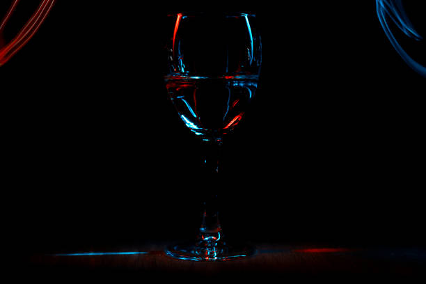 istock A wineglass or goblet. The game of reflected light effect. On a black background. 911016016