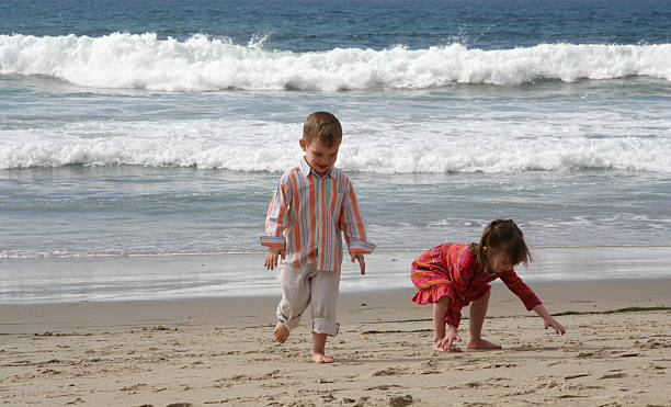 istock Kids playing in the sand 91101729