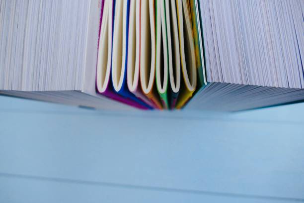 istock Colorful notebooks betwenn  thick books 911018338