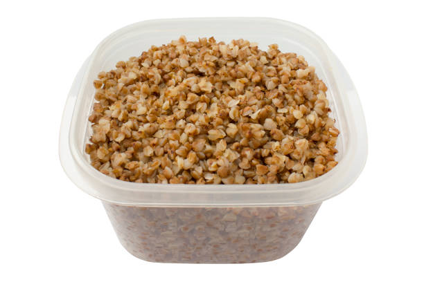 istock Boiled buckwheat in a food container on a white background. Isolated 911019042