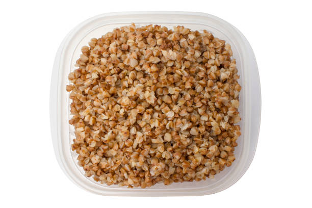 istock Boiled buckwheat in a food container on a white background. Isolated 911019068