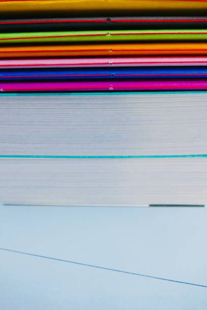 istock Colorful notebooks lying on thick books 911022546