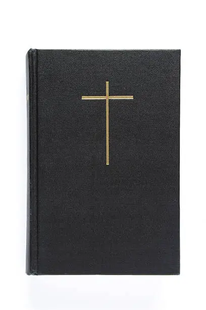Photo of Black bible with cross on the cover