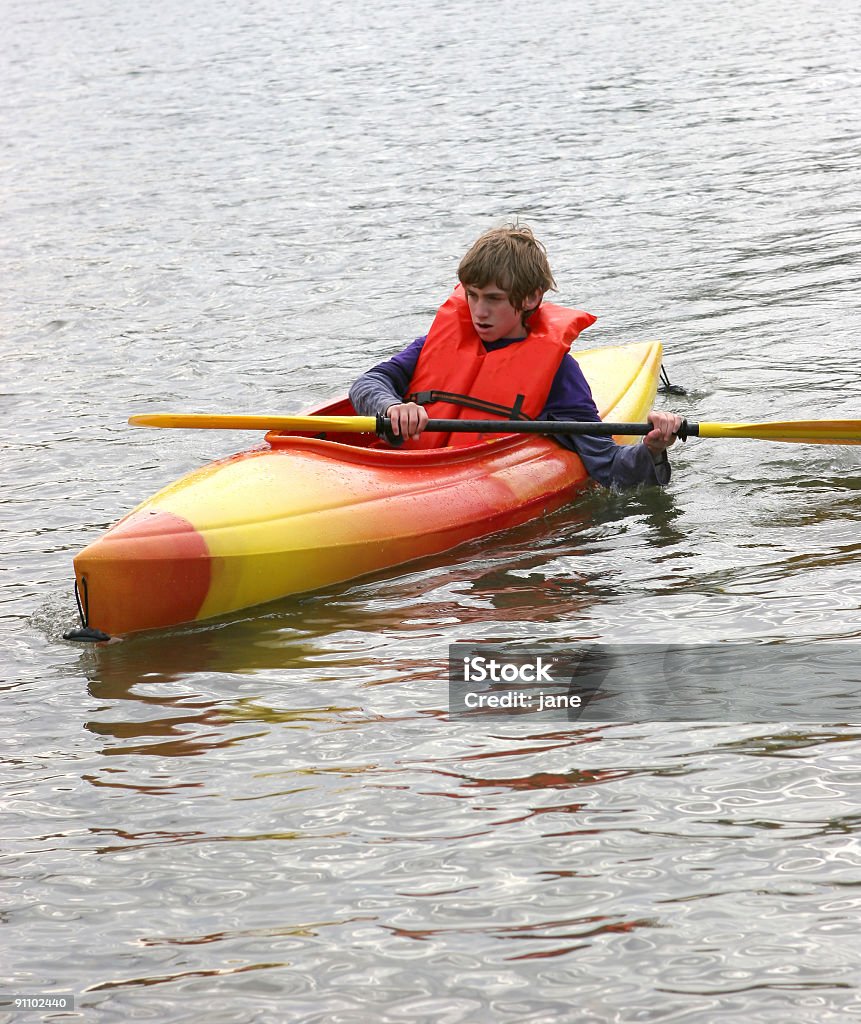 Menino andando de caiaque - Foto de stock de Caiaque - Barco a remo royalty-free