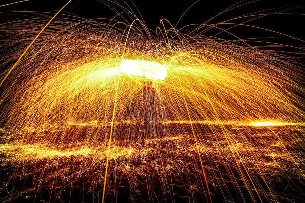 istock Spark Lasso - Fire being thrown around man's head, signifying creativity 911025808