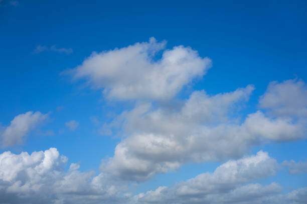istock Blue summer sky white cumulus clouds 911026226