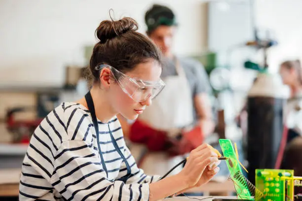 Teenage girl concentrating during STEM lesson.