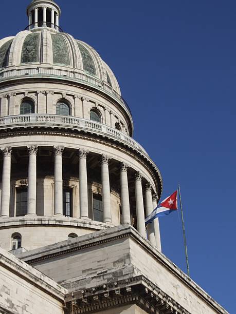 Capitolio dome and cuban flag stock photo