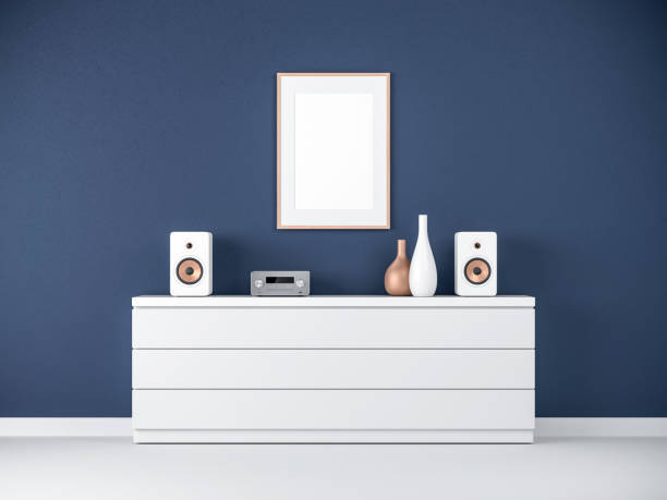 istock Poster Frame Mockup on bureau in modern interior, Micro hi fi stereo System 911031004