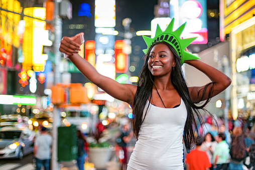African American woman visiting Times Square in New York City