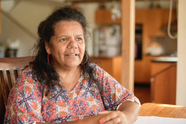 Aboriginal woman in her 50s with contemplative expression