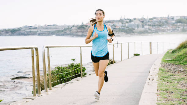 istock Young Asian Woman Running 911034856
