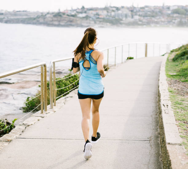 istock Young Asian Woman Running 911037200