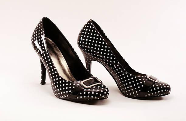 Patent leather polka dot pumps stock photo