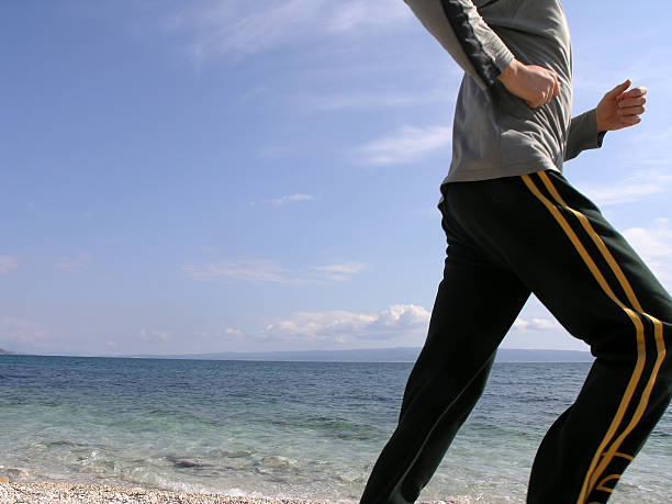 Jogging at the beach stock photo