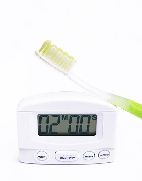 toothbrush and timer stock photo