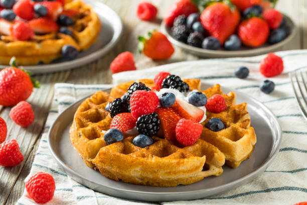 Sweet Homemade Berry Belgian Waffle Sweet Homemade Berry Belgian Waffle with Whipped Cream waffle stock pictures, royalty-free photos & images