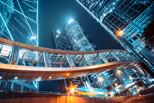 Footbridge and Modern office buildings in central Hong Kong at night