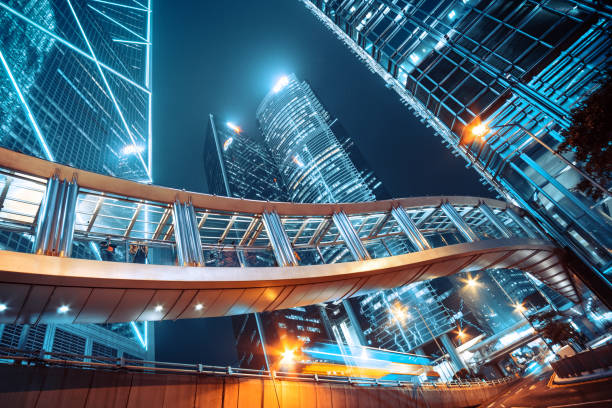 footbridge and corporate buildings in central hong kong - hong kong china city night imagens e fotografias de stock