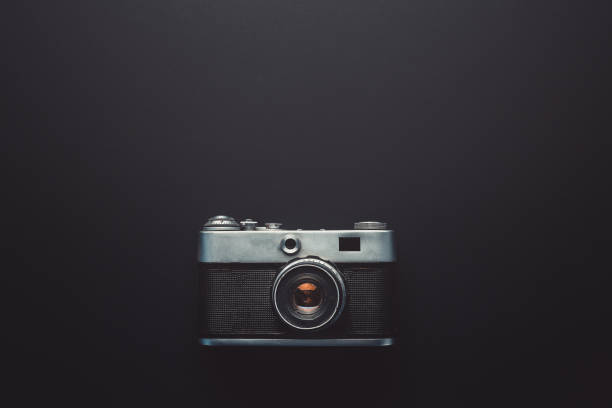 istock Creativity Retro Technology Concept. Film Cameras On Black Background, Top View 911096670