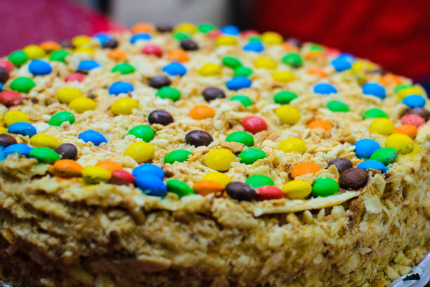 istock cake close-up decorated with sweets of different colors 911097290