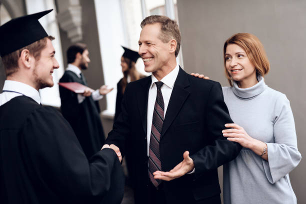 istock Parents congratulate the student, who finish their studies at the university. 911100976