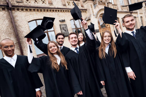 istock Graduates of the university toss their caps up. 911101080