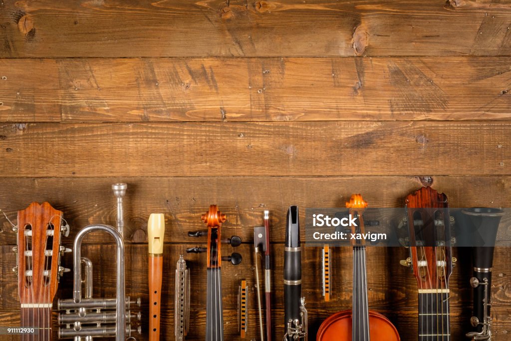 instruments background instruments in wood background Musical Instrument Stock Photo