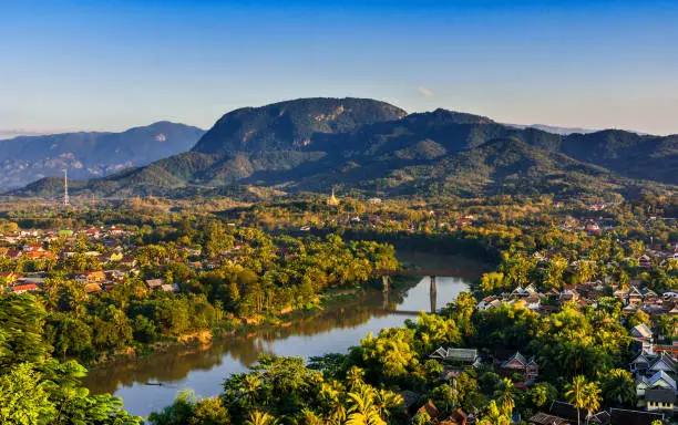 Luang Prabang, Laos, Southeast Asia: Landscape view over the city in the sunset lights from Mount Phousi, a sacred mountain located in the heart of the former capital of Laos