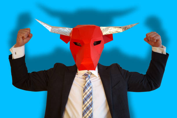 businessman with bull mask flexing his muscles businessman with bull mask and blue background flexing his muscles arrogant-business-man stock pictures, royalty-free photos & images