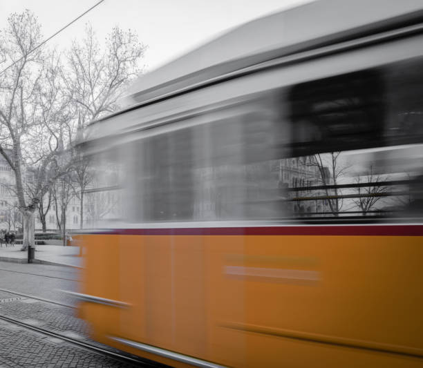 istock Tram moving past the Budapest Parliament building 911138282