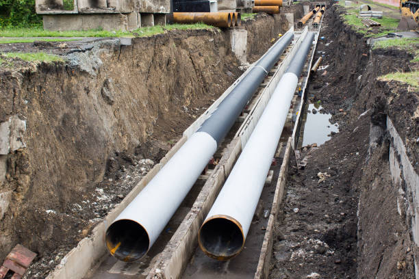 Repair of urban water supply. The trench with pipes. stock photo