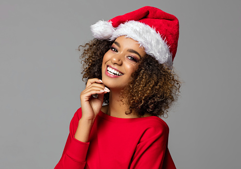 Beautiful african american female model wear santa hat
