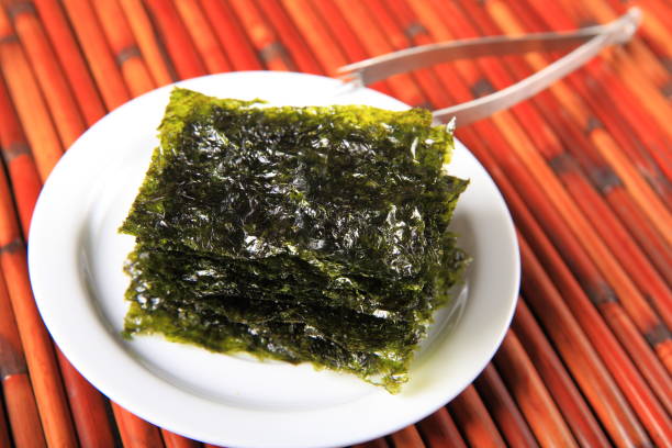 istock Dried seaweed on white plate 911154088