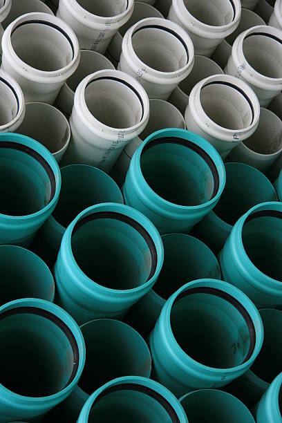 Green and White PVC Pipes  pvc conduit stock pictures, royalty-free photos & images