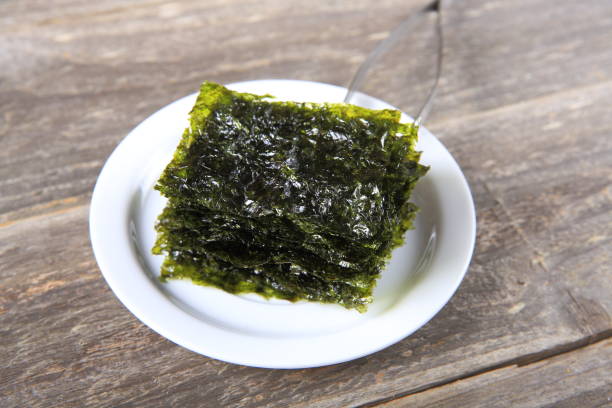 istock Dried seaweed on white plate 911158444