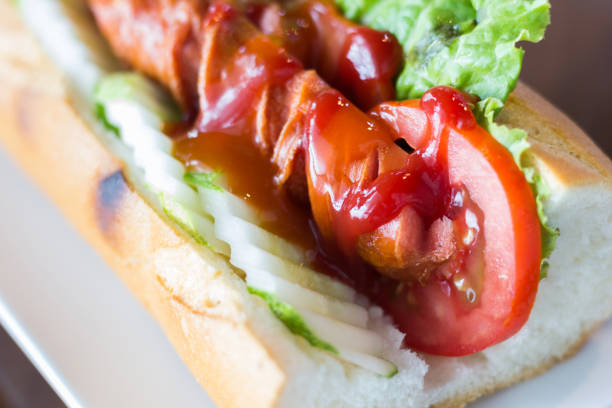 istock Hot dog with pickles, tomato and lettuce 911162006
