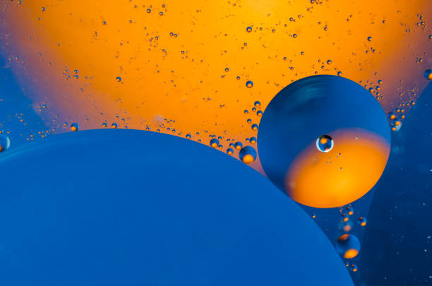 istock Oil drops on water surface abstract background 911162236