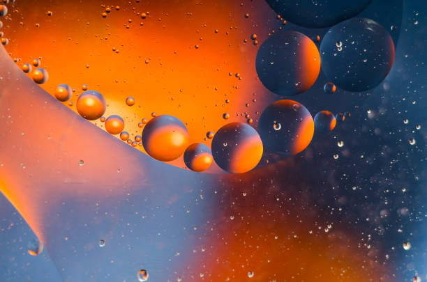 istock Oil drops on water surface abstract background 911166398