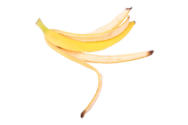 istock yellow banana peel on a white background 911166850