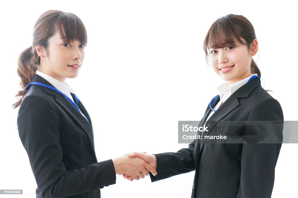 Businesspersons shaking hands Handshake Stock Photo