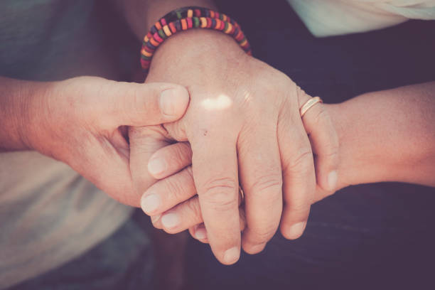 istock elderly senior hands touching stay together 911175020
