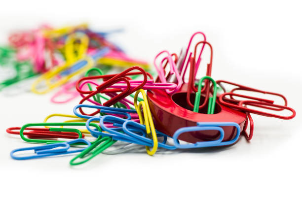 Magnet and paper clips isolated on a white background