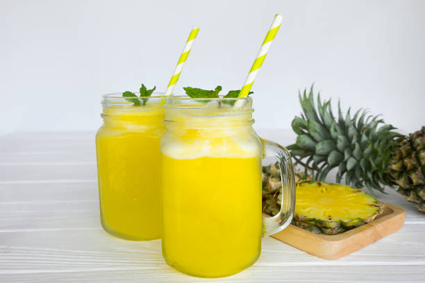 istock pineapple smoothie and pineapple fruits 911180514