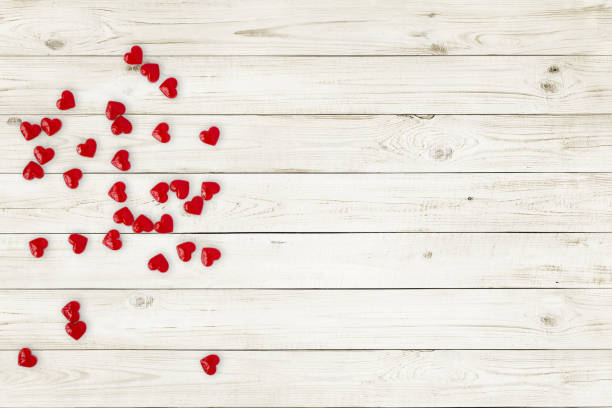 Red hearts Candy on wood