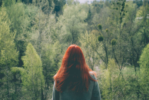 Young woman holding hand on the bridge, leading to adventure