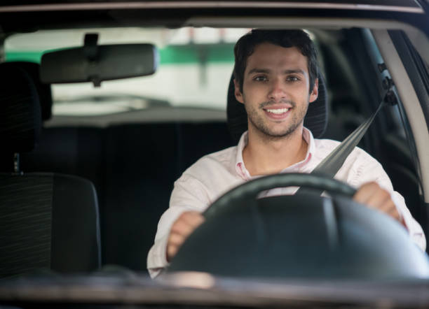 istock Happy man driving a car at the garage 911190208