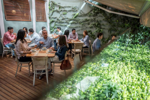 istock Large group of casual people at a cafe 911190302
