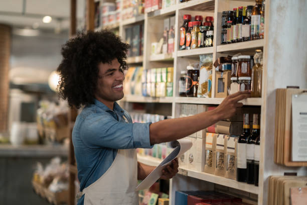 istock Happy man checking the inventory at a grocery store 911190348