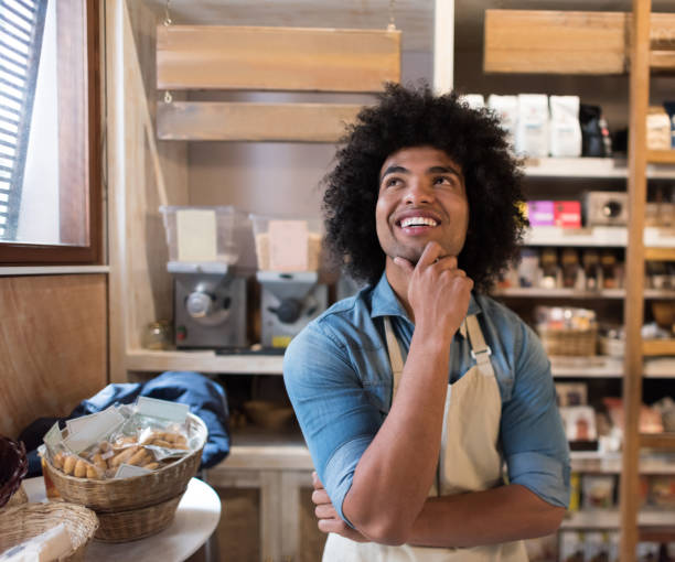 istock Thoughtful business man working at a grocery store 911190380